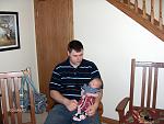 My son holding his son @ 6 weeks. Babies first pair of all stairs